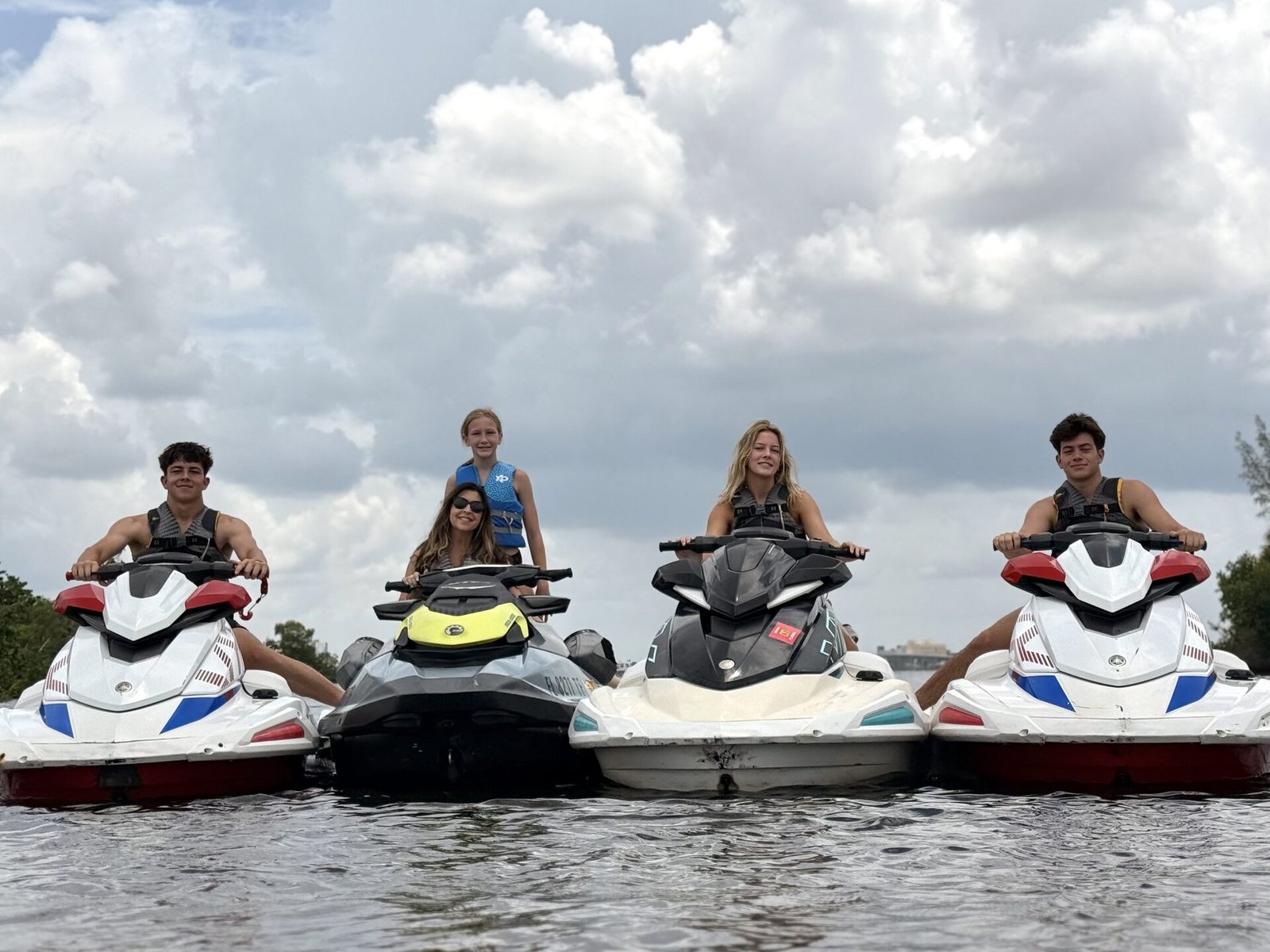 Family riding jet ski rentals near Fort Myers